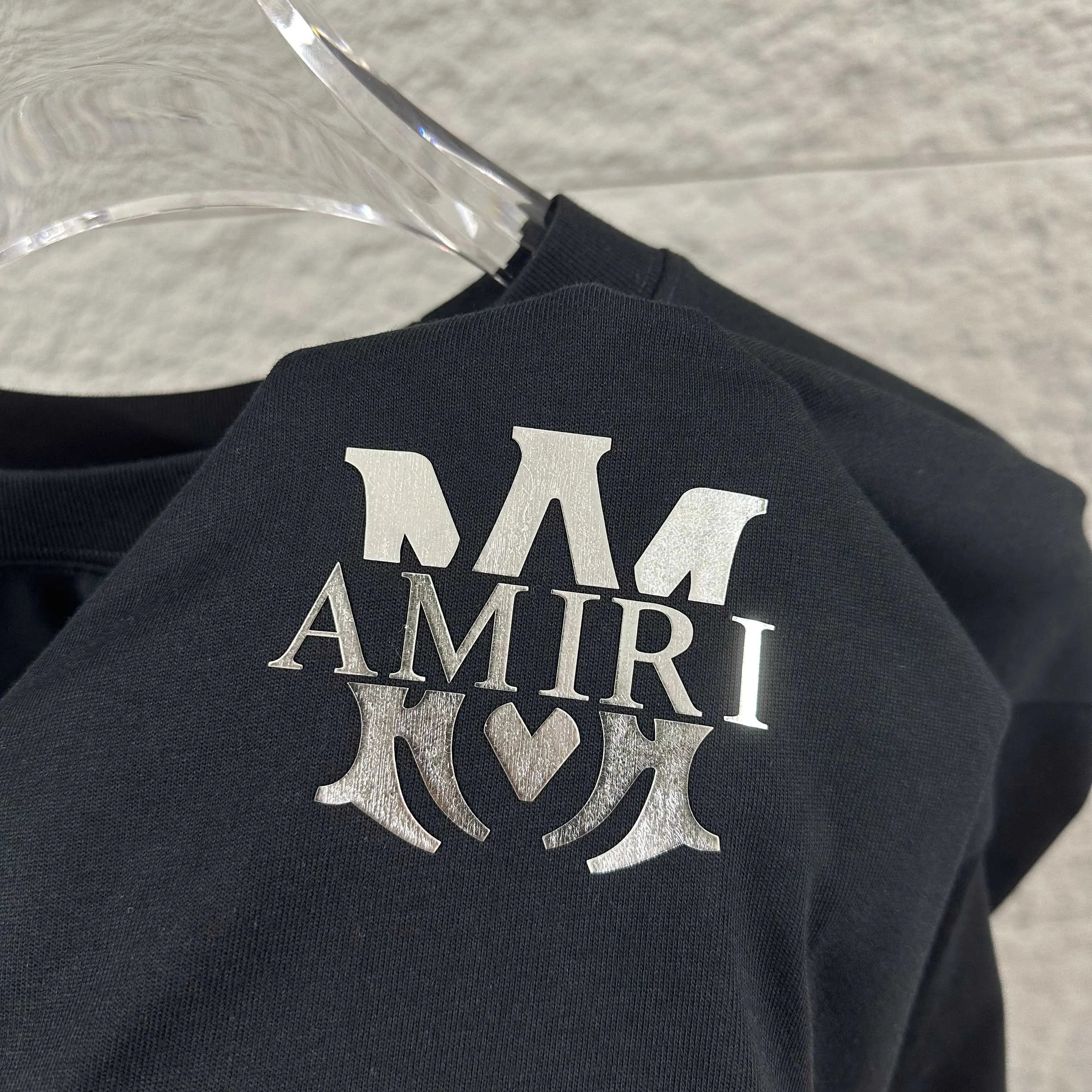 Amiri*Emile 2026 Early Spring and Summer New Arrival Customized plain cotton double yarn fabric Short-sleeved T-shirt Classic letter silvering process Men and women Same Style Color: Black White Size: S (90-130 pounds) M (120-150 pounds) L (140-165 pounds) XL (160-180 pounds) XXL (180 pounds)