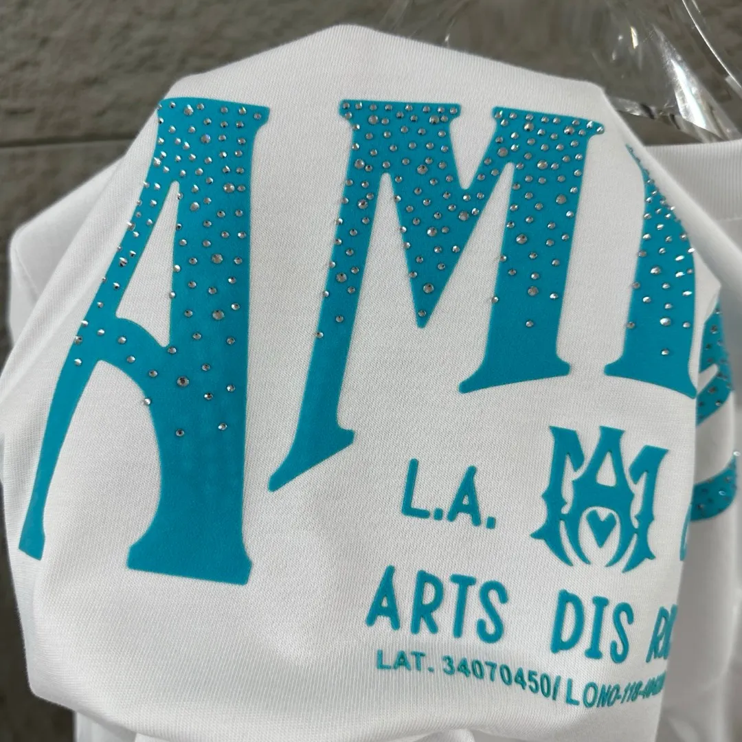 Amiri*Emile 2026 Early Spring and Summer New Arrival Customized plain cotton double yarn fabric Short-sleeved T-shirt Classic letter hot diamond + flocking technology Men and women Same Style Color: Black White Size: S (90-130 pounds) M (120-150 pounds) L (140-165 pounds) XL (160-180 pounds) XXL (180 pounds)