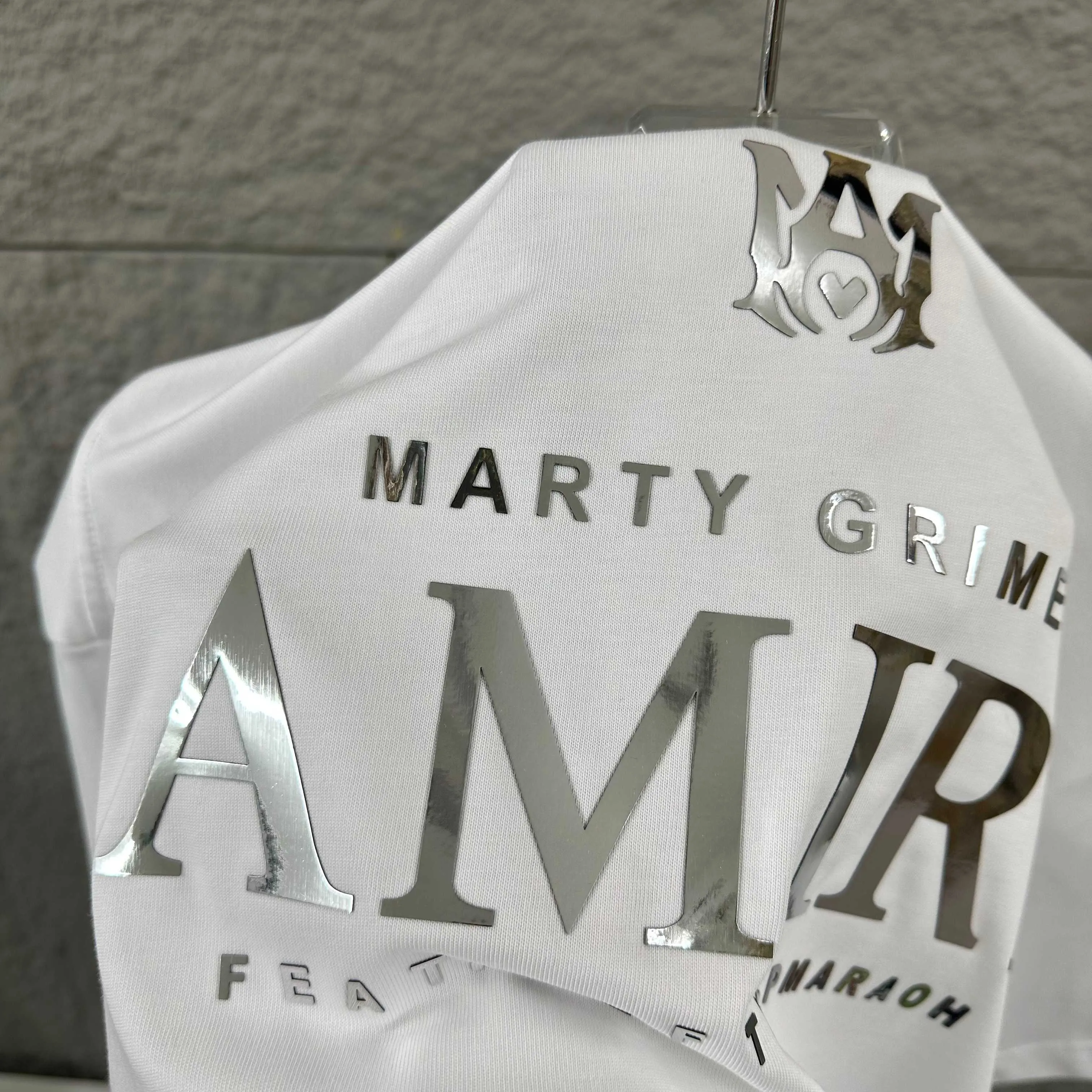 Amiri*Emile 2026 Early Spring and Summer New Arrival Customized plain cotton double yarn fabric Short-sleeved T-shirt Classic letter silvering process Men and women Same Style Color: Black White Size: S (90-130 pounds) M (120-150 pounds) L (140-165 pounds) XL (160-180 pounds) XXL (180 pounds)