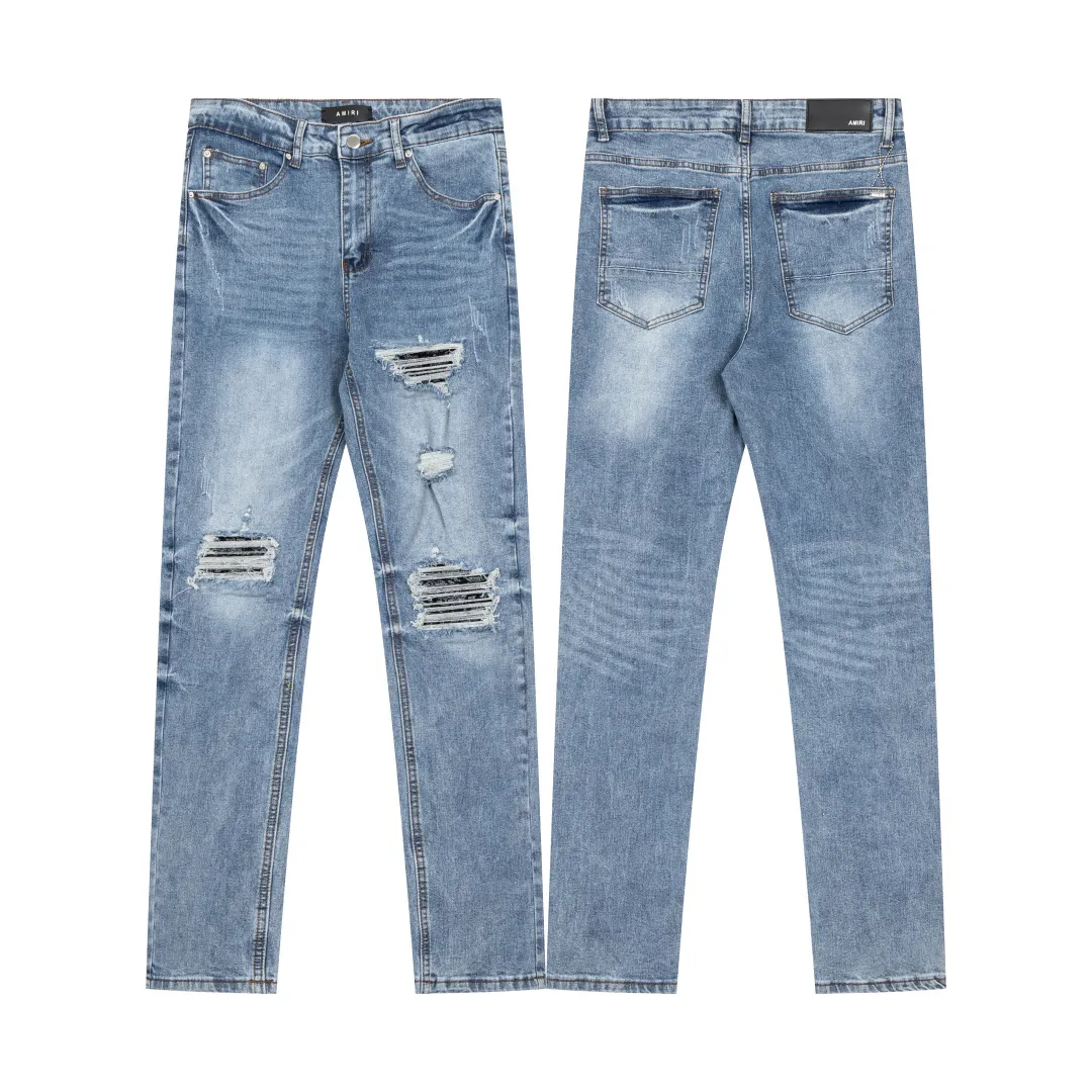 (Top version) AMIRI's new high-luxury heavy-duty stretch washed hole patch high-street fashionable men's and women's couple jeans AMIRI's family uses organic long-staple cotton denim fabrics originating in Los Angeles this year! After a pure natural alkaline phosphatase washing process, the special blue Gray tone is noble and high-end. It feels skin-friendly and delicate, and the inner layer is particularly comfortable when touching the skin! The elastic spandex component makes it particularly comfortable for daily activities. The original and rare Premium fabric is a rare find! Details after details! Amiri's New Arrival high street luxury jeans in Los Angeles mall! The front and back pieces have undergone a multi-layered three-dimensional polishing process, giving the upper body a stylish texture! The metal laser embossed MA metal Brown Nappa leather label on the waist is very exquisite! The pockets are also inlaid with tungsten steel metal logos, and the interior has exquisite ceiling-level workmanship! Hot sale jeans in Los Angeles counters! Enjoy the quality when you wear it yourself, and the value is high as a gift! Manage any large-scale business occasions and Premium private clubs without stress! Highly recommended to buy! Style number: 2040 Color: Blue Size: 28 30 32 34