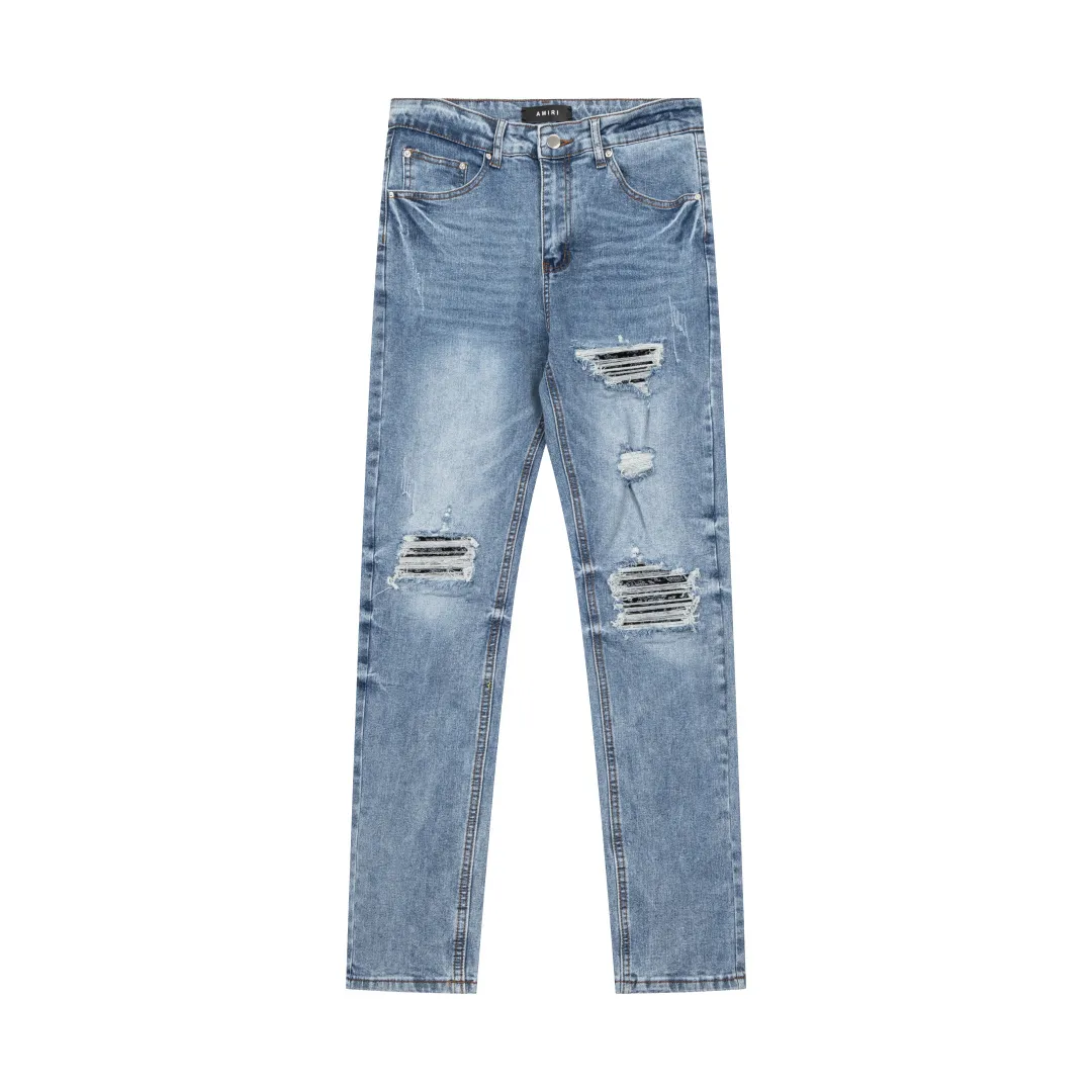 (Top version) AMIRI's new high-luxury heavy-duty stretch washed hole patch high-street fashionable men's and women's couple jeans AMIRI's family uses organic long-staple cotton denim fabrics originating in Los Angeles this year! After a pure natural alkaline phosphatase washing process, the special blue Gray tone is noble and high-end. It feels skin-friendly and delicate, and the inner layer is particularly comfortable when touching the skin! The elastic spandex component makes it particularly comfortable for daily activities. The original and rare Premium fabric is a rare find! Details after details! Amiri's New Arrival high street luxury jeans in Los Angeles mall! The front and back pieces have undergone a multi-layered three-dimensional polishing process, giving the upper body a stylish texture! The metal laser embossed MA metal Brown Nappa leather label on the waist is very exquisite! The pockets are also inlaid with tungsten steel metal logos, and the interior has exquisite ceiling-level workmanship! Hot sale jeans in Los Angeles counters! Enjoy the quality when you wear it yourself, and the value is high as a gift! Manage any large-scale business occasions and Premium private clubs without stress! Highly recommended to buy! Style number: 2040 Color: Blue Size: 28 30 32 34