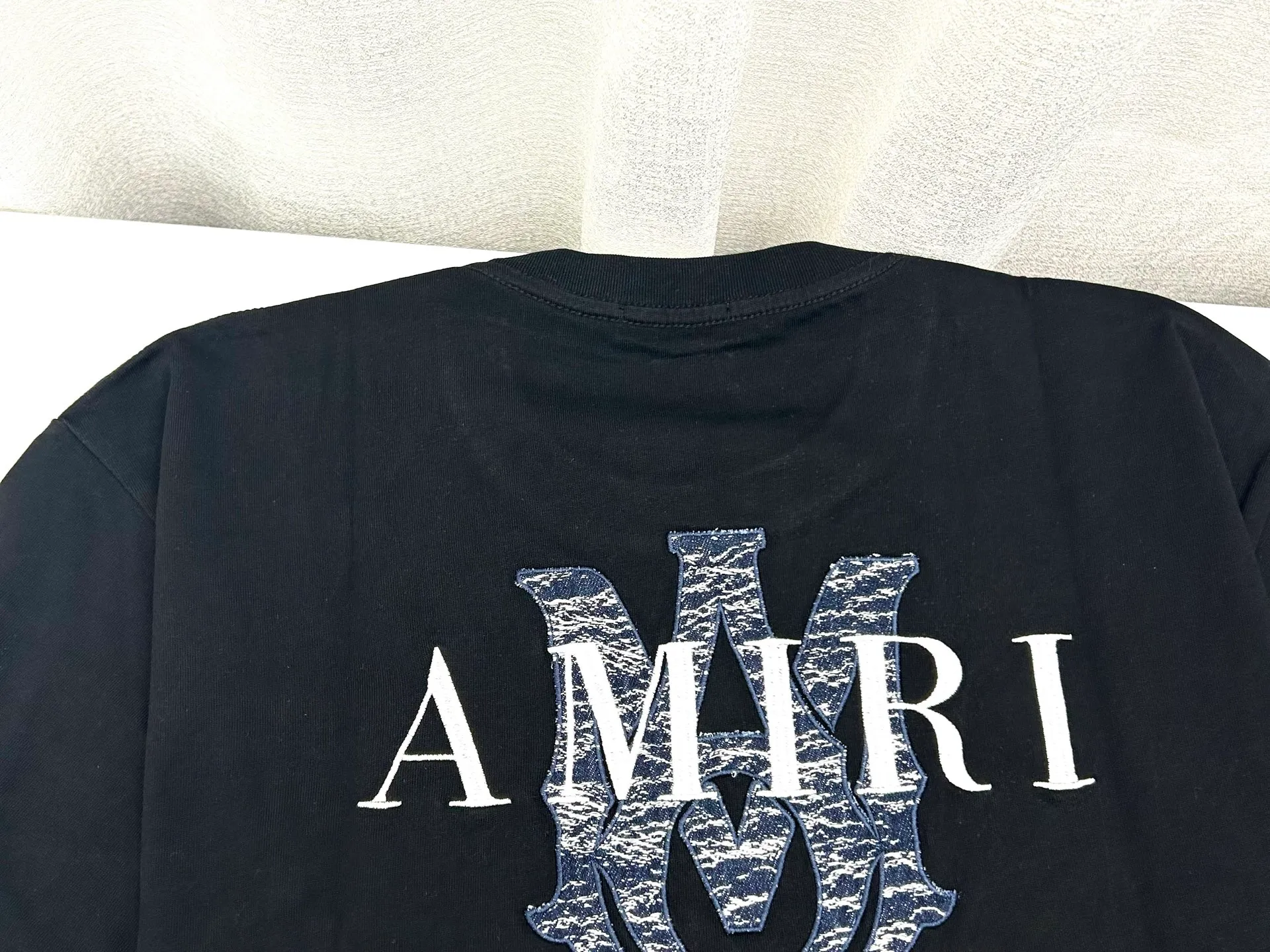 AMIRI logo m-xxl