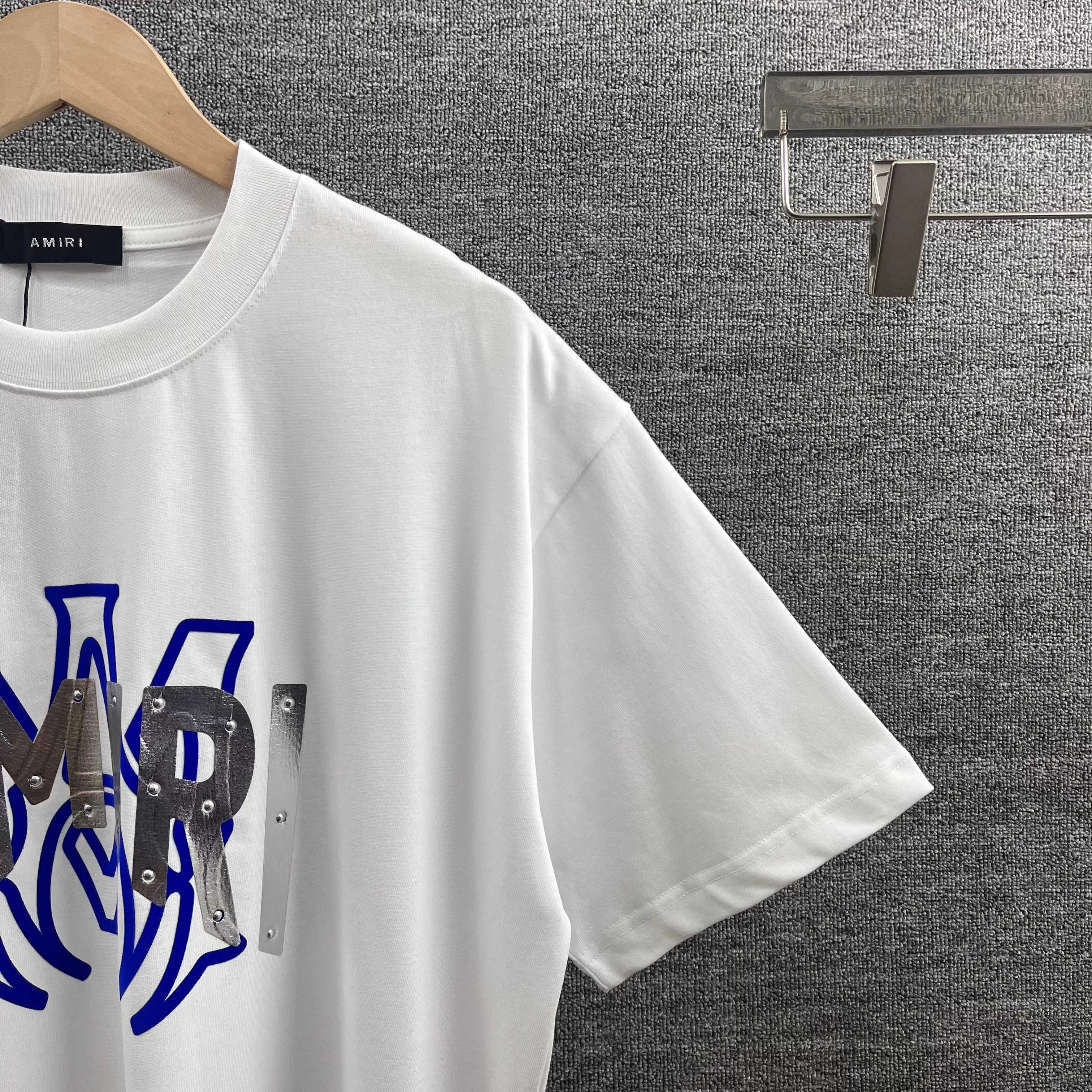 Amir*E*mir 2026 spring and summer New Arrival short-sleeved T-shirt Classic letters Silver silicone + flocking technology Customized plain cotton double yarn fabric Men and women Same Style Color: Black White Size: S (90-130 pounds) M (120-150 pounds) L (140-165 pounds) XL (160-180 pounds) XXL (180 pounds)