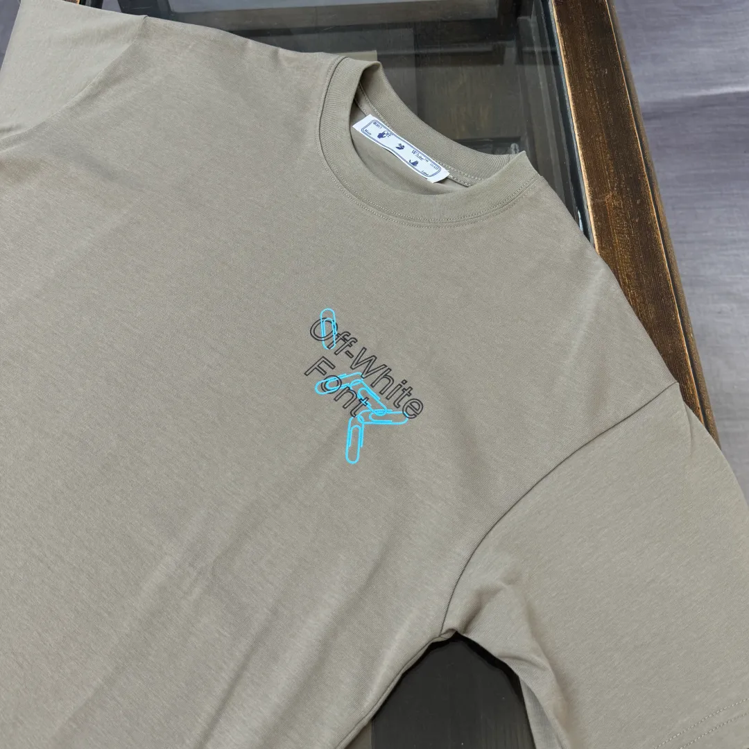 C🌟 OFF-WHITE 2026ss new spring and summer couple's round neck T-shirt🔥 Luxurious brand letter LOGO mark👍🏼 You can feel the youthfulness and fashion brought by this design on your upper body! The overall style is fashionable and trendy. The fabrics are made of top-quality fabrics supplied by customers. They are soft, skin-friendly, breathable, and have good stiffness and drape. The upper body is in fashionable and trendy colors. It is a must-have item for summer! Color: Black White Size: XS-S-M-L (loose fit, please state your height and weight when placing an order)