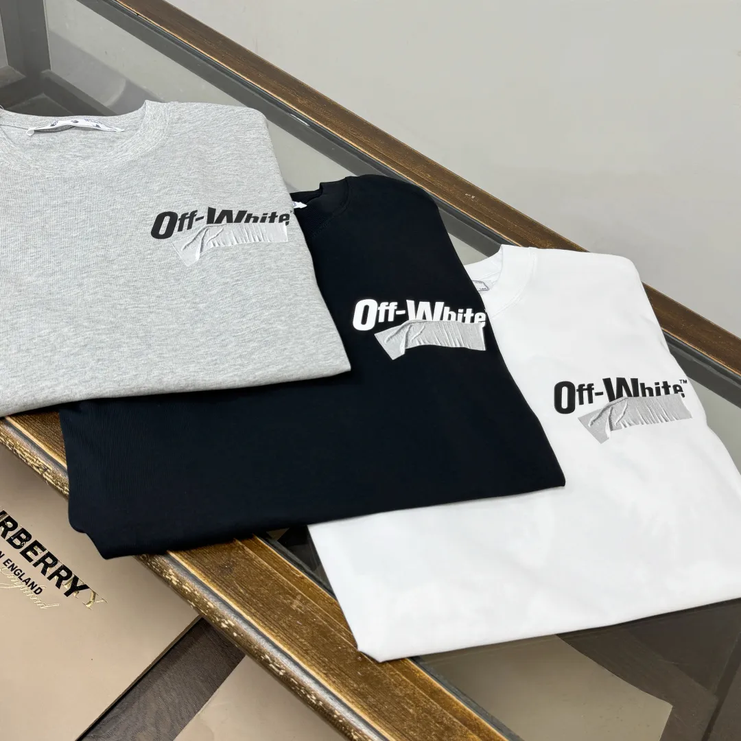 C🌟 OFF-WHITE 2026ss new spring and summer couple's round neck T-shirt🔥 Luxurious brand letter LOGO mark👍🏼 You can feel the youthfulness and fashion brought by this design on your upper body! The overall style is fashionable and trendy. The fabrics are made of top-quality fabrics supplied by customers. They are soft, skin-friendly, breathable, and have good stiffness and drape. The upper body is in fashionable and trendy colors. It is a must-have item for summer! Color: Black White Gray Size: XS-S-M-L (loose fit, please state your height and weight when placing an order)