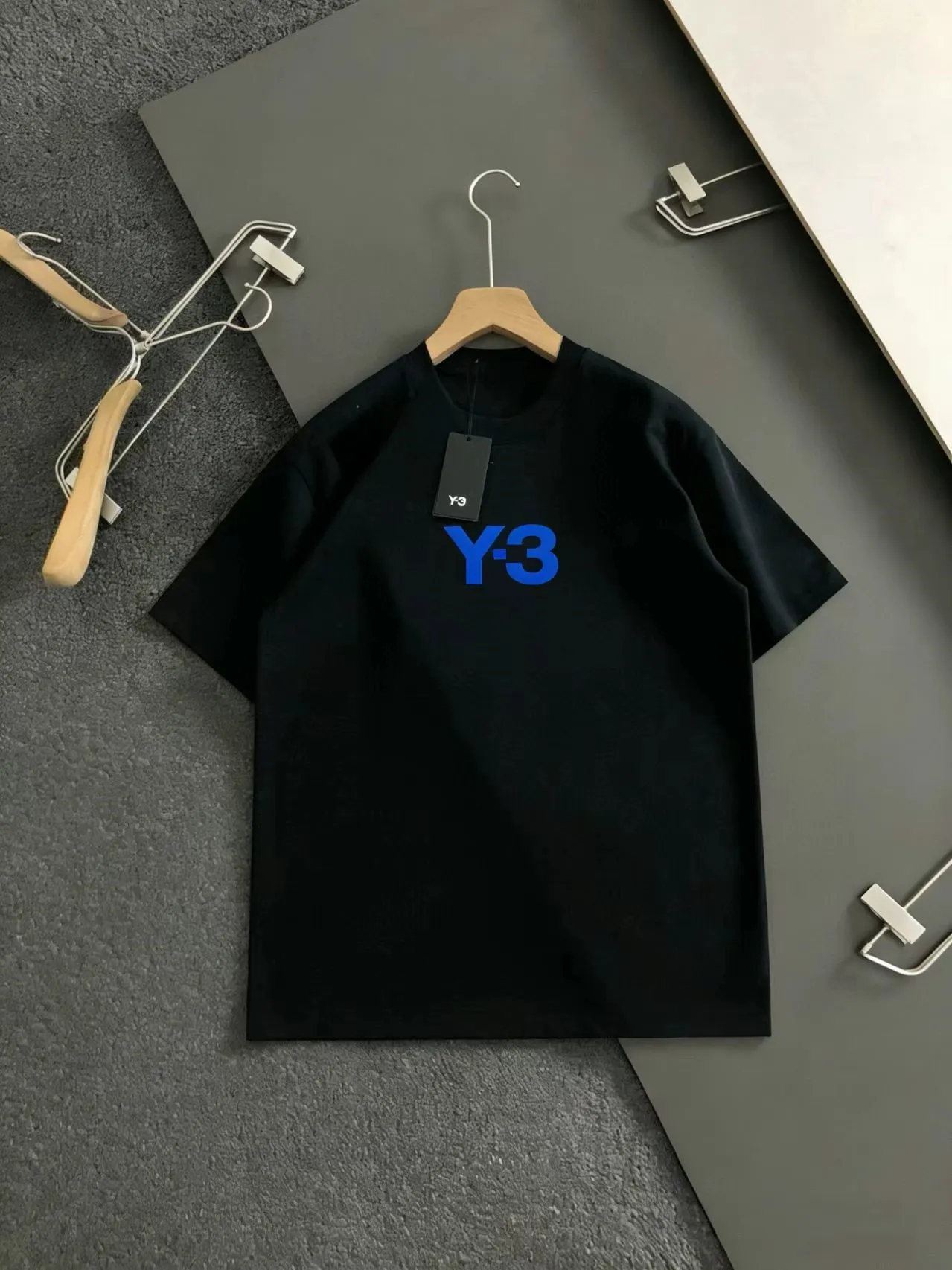 "𝙉𝙚𝙬🤍🖤Y 3 Home" Y-3 short sleeves are an innovative fusion of trend and personality! Simple and refreshing, giving people a clean and neat feeling. The design on the back is amazing! Red's "Y-3" lettering adopts a unique fragmented splicing style, which is full of personality, like an artistic creation that breaks the rules. There is Red's signature style next to it, adding a bit of casualness and uninhibitedness. M-XXXL
